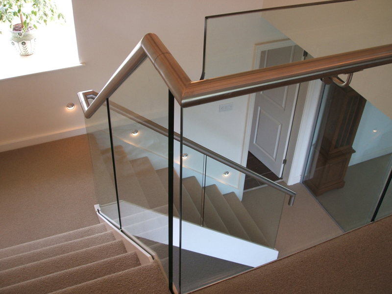 What is the difference between handrails and balustrades?